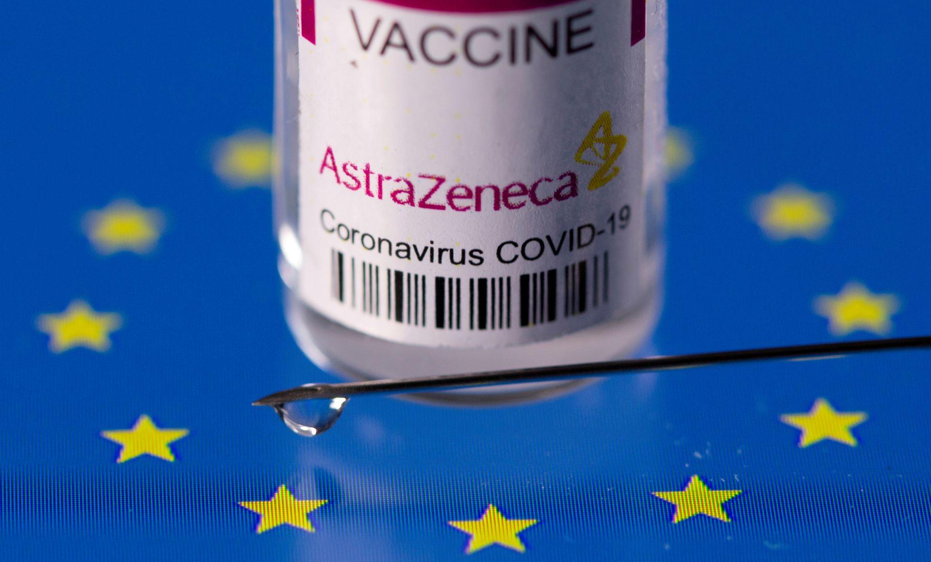 Vial labelled "AstraZeneca coronavirus disease (COVID-19) vaccine" placed on displayed EU flag is seen in this illustration picture taken March 24, 2021. - Avaz