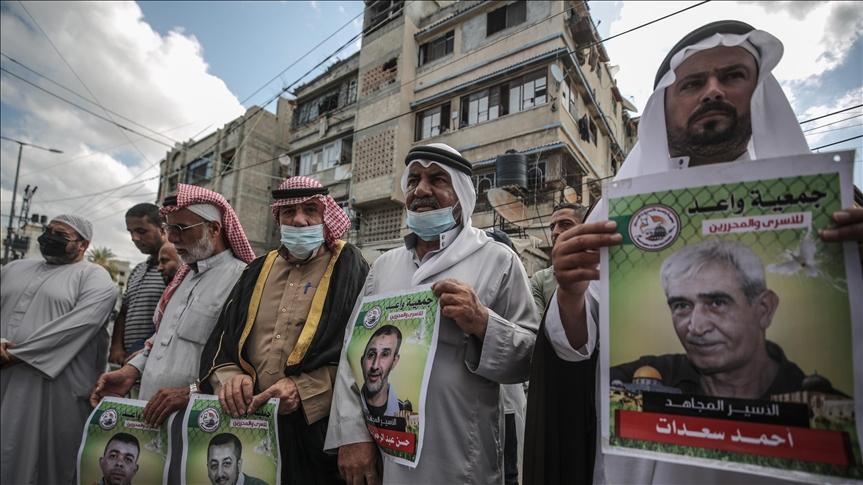 Members of the Palestinian Islamic Jihad Movement march from the Khan Yunis Refugee Camp in solidarity with Palestinian prisoners in Israeli jails, in Khan Yunis in the southern Gaza Strip on September 27, 2021. - Avaz