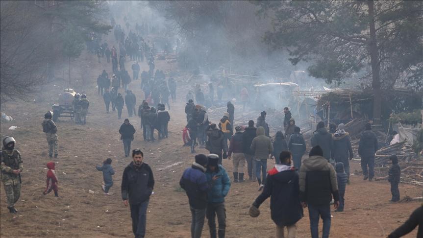 Migrants on Belarus-Poland border return to camps in forest area